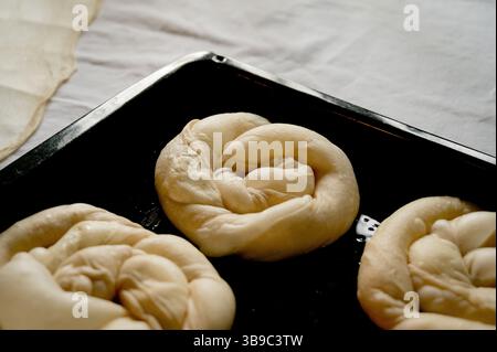 Raw cottage cheese pies in baking tray Stock Photo