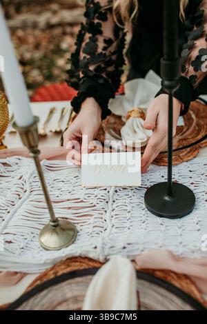 Fall Picnic Styling with Bride Tablesetting Stock Photo