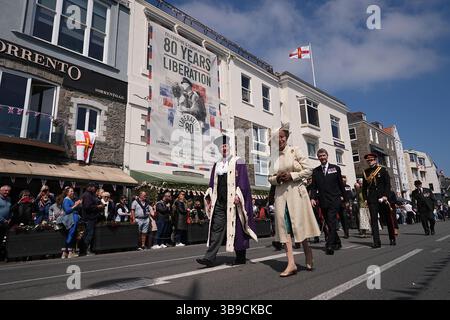 The Princess Royal, accompanied by Vice Admiral Sir Tim Laurence (second row, right), during a visit to St Peter Port, as they attend commemorations in Guernsey and Sark marking the 80th Anniversary of the Liberation of the Bailiwick. Picture date: Friday May 9, 2025. Stock Photo
