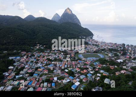 Aerial top down view of the city of Soufriere with Pitons in the background. Shot on a DJI Drone Air 2s in the Caribbean on beautiful Saint Lucia. Stock Photo