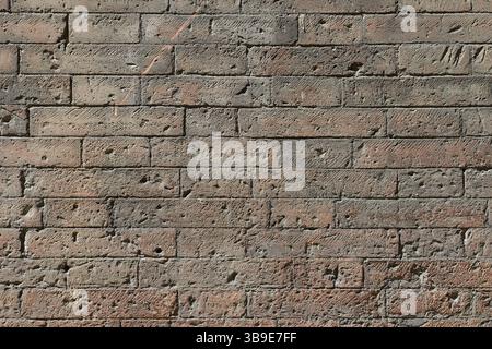 Abstract pattern of an old  brick wall with lots of texture useful for backgrounds and wallpapers. Stock Photo