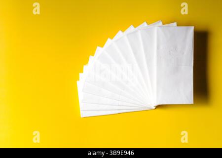 A neatly arranged stack of white dry tissues on a plain background. The image highlights the soft texture, cleanliness, and hygienic nature of the pro Stock Photo