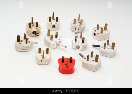 A collection of used UK three pin electrical plugs. Stock Photo