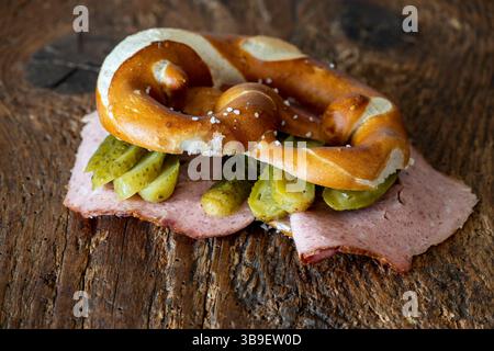 Liver loaf in a pretzel on wood Stock Photo