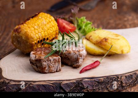 Grilled pork fillet on wood Stock Photo