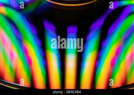 Water drops on a CD create an explosion of colour Stock Photo