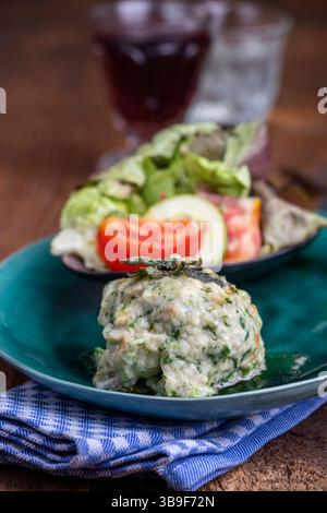 Rustic spinach dumpling with salad Stock Photo