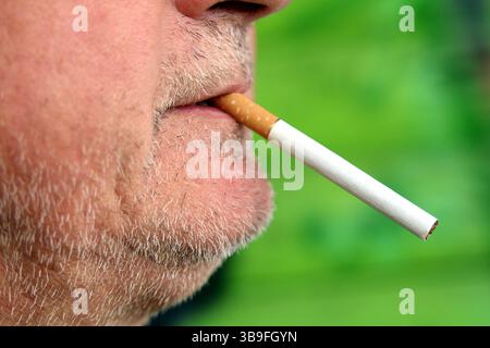 Man with a cigarette in his mouth Stock Photo