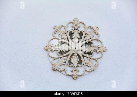 Decorative ornament on white house wall Stock Photo