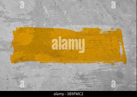 Grey grunge wall and yellow orange graffiti area with text space Stock Photo