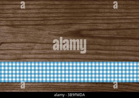 Tablecloth stripes blue white on brown wooden background Stock Photo