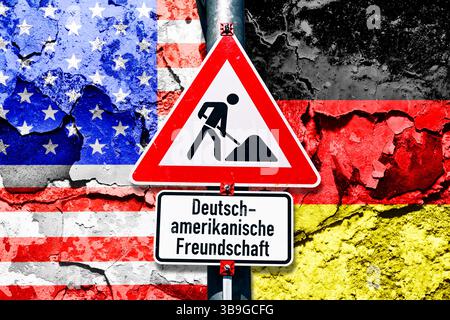 Construction site sign with inscription German-American friendship in front of flags of USA and Germany on broken ground, photomontage Stock Photo