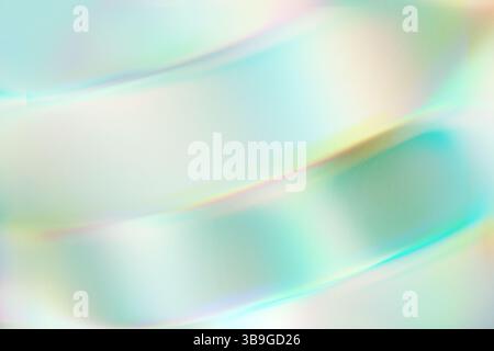 A serene abstract image showcasing a soft gradient of pastel hues. Gentle blues and greens blend seamlessly with subtle hints of pink and yellow to cr Stock Photo
