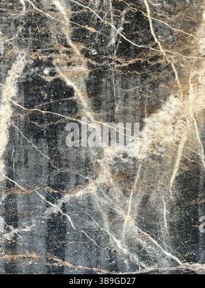 High-resolution image of natural marble, featuring dark and light contrast with intricate veining patterns. Ideal for backgrounds, design projects, an Stock Photo