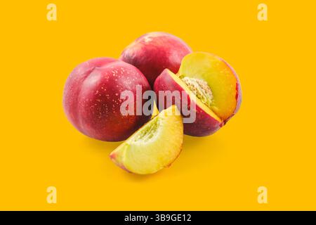 Fresh nectarines, whole and sliced, creating a colorful and appetizing arrangement Stock Photo
