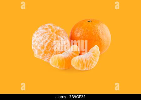 One peeled mandarin and one whole mandarin with two segments on an orange background, creating a vibrant and juicy citrus display Stock Photo