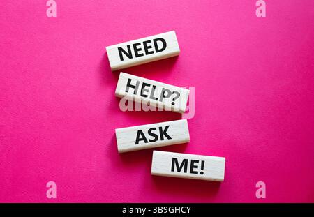 Need help ask me symbol. Concept words Need help ask me on wooden blocks. Beautiful red background. Business and Need help ask me concept. Copy space Stock Photo