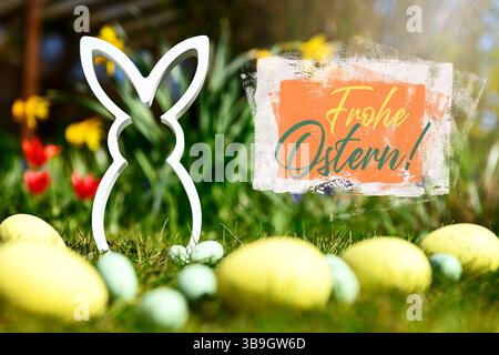 Easter bunny figure with Easter eggs and Happy Easter lettering, photomontage Stock Photo