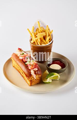 Lobster roll with chips and dips Stock Photo