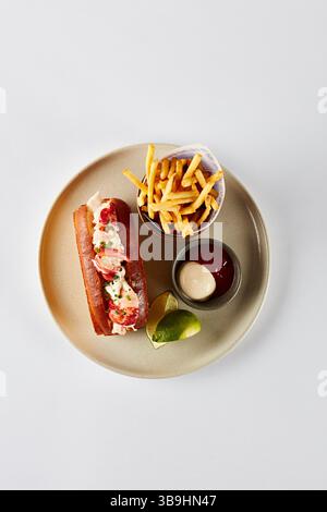 Lobster roll with chips and dips Stock Photo