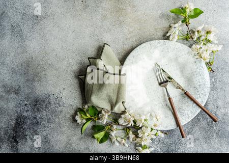 Spring table setting with cherry blossoms Stock Photo