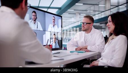 Medical Professionals Engage In Webinar To Discuss Patient Diagnosis And Treatment. Stock Photo