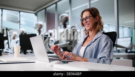 Future Of Corporate Office: Woman Coding With AI Advisor Robots. Stock Photo
