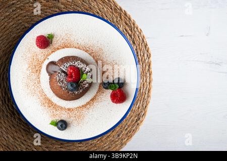 Beautiful chocolate lava cake coulant from a top view with christmas decorations. Stock Photo