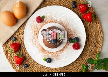 Beautiful chocolate lava cake coulant from a top view with christmas decorations. Stock Photo