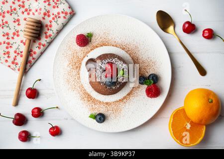 Beautiful chocolate lava cake coulant from a top view with christmas decorations. Stock Photo