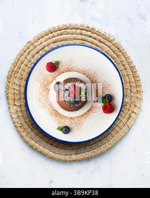 Beautiful chocolate lava cake coulant from a top view with christmas decorations. Stock Photo