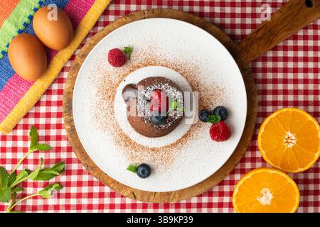 Beautiful chocolate lava cake coulant from a top view with christmas decorations. Stock Photo