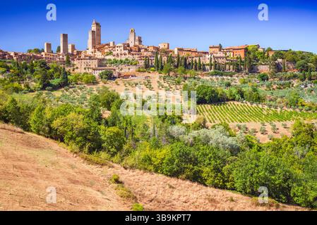 San Gimignano and Tuscany in Italy. Medieval town skyline with famous towers in sunny day Stock Photo
