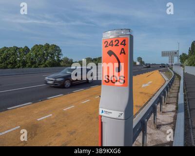 SOS phone point in an emergency refuge, M4 motorway, Dorney Reach, Bucks, UK. Stock Photo
