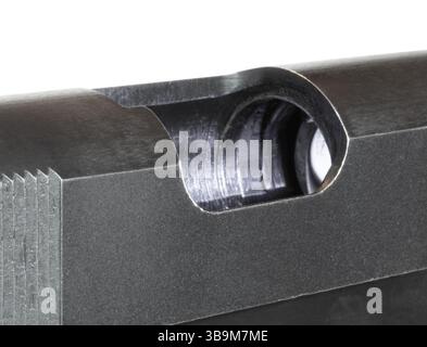 Isolated 1911 pistol that has its slide back to and showing that its chamber is empty indicating it is safe to work on or handle isolated on a white b Stock Photo