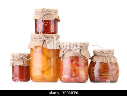 Many jars with different pickled products isolated on white Stock Photo