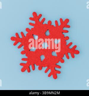 This vibrant red felt snowflake add a cheerful touch to any winter decor. Perfect for festive decorating, this unique piece showcases intricate design. Stock Photo