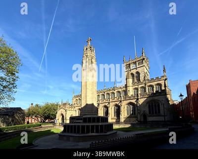 Parish church of All Saints and war memorial in Wigan town centre Stock Photo