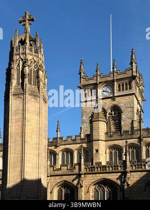 Parish church of All Saints and war memorial in Wigan town centre Stock Photo