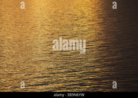 Sun rays are reflected on the sea surface, small waves, Baltic Sea Stock Photo