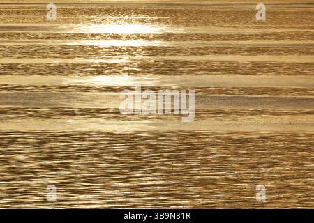 Sun rays are reflected on the sea surface, small waves, Baltic Sea Stock Photo