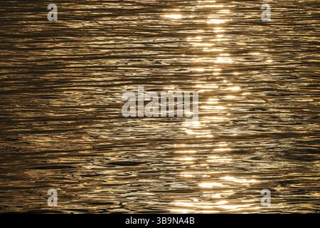 Sun rays are reflected on the sea surface, small waves, Baltic Sea Stock Photo