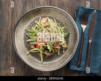 Delicious pork meat salad with cucumber in asian style with amaranth popcorn or popped amaranth (replaceable sesame). Idea salad recipe for healthy fo Stock Photo