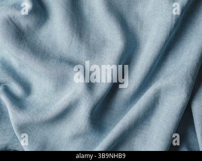 Modern soft jeans blouse texture close up. Lyocell or tencel pattern - modern natural cellulose fabric blue denim color. Can use for design or text. C Stock Photo
