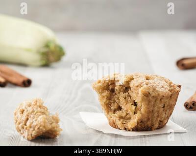 Close up view of muffin with zucchini, carrots, apple and cinnamon on gray wooden background. Sweet vegetables homemade muffins. Toddler-friendly reci Stock Photo