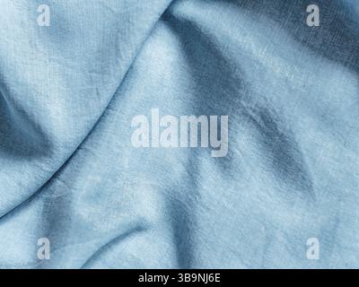 Modern soft jeans blouse texture close up. Lyocell or tencel pattern - modern natural cellulose fabric blue denim color. Can use for design or text. C Stock Photo