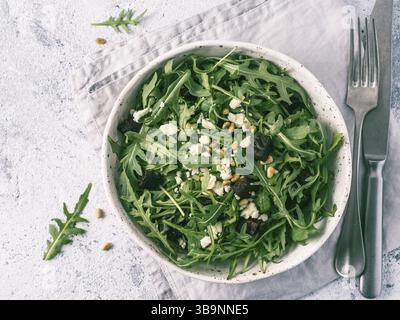 Beetroot, aragula and soft cheese salad over gray background. Top view or flat lay. Copy space for text. Idea and recipe for healthy vegetarian salad. Stock Photo