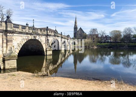 River Severn flowing under the English Bridge with exposed bank in Shrewsbury Stock Photo