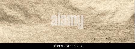 Golden foil texture with a smooth, minimal surface. Subtle shimmer and gentle glow create an elegant, luxury backdrop. Warm, brushed pattern with a re Stock Photo