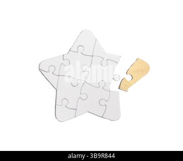 Golden star-shaped puzzle piece symbolizing success, achievement, and the pursuit of a goal. The missing piece represents potential and ambition, embo Stock Photo